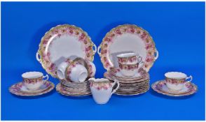 German 33 Piece Part Tea Service. Pink and green floral pattern borders with gilt trim. Comprising
