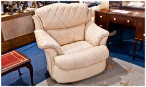 A Good Quality Modern and Expensive Pair of Cream Leather Armchairs with padded quilted cushions -
