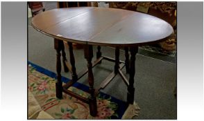 An Oak Gate-leg Table of Unusual Form. 54 x 36 Inches Top, 29.5 Inches High. Late 20th Century,