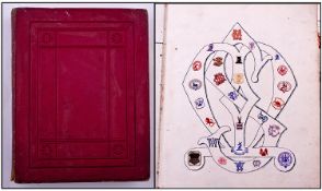 An Unusual Victorian Red Leather Morocco Album containing hundreds of embossed crests (many scarce)