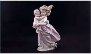 Lladro Event Figure, 2000 ` Young Girl Carrying a Baby ` Model No.6681. 9.5 Inches Tall. Mint