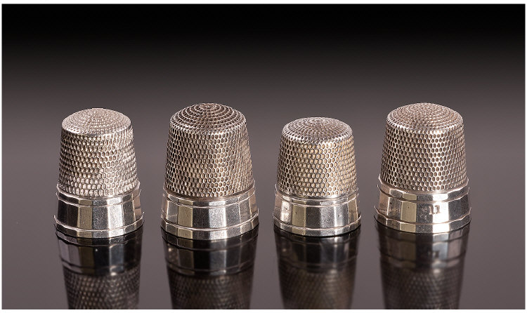 A Set of Four American Silver Thimbles. Each with a multi faceted rim, Unmarked but test silver.