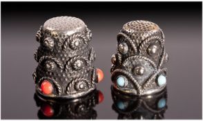 A Pair of Silver Thimbles. The oxidized outer surface decorated with semi circular rope twists