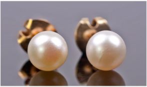 Mikimoto Pair of 14ct Gold Set Cultured Pearl Earrings. Marked 14kt. Boxed.