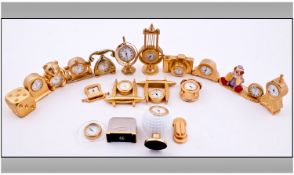 Collection of 17 novelty miniature brass clocks, comprising golf ball, toaster, globe, Teddy bear,