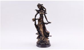 Italian Bronzed Effect Figure Of A Woman, raised on a circular wooden plinth. Height 15 inches.