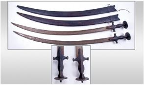 Two Indian Tulwar Swords, Complete With Scabbards, Length 35 Inches.