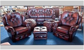 Classic Six Piece Cherry Red Leather Suite comprising a three seater sofa, two armchairs, footstool