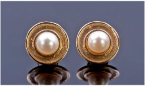 Ladies Pair of 9 Carat Gold Circular Shaped Pearl Set Earrings for pierced ears.
