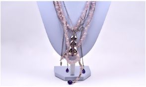 Ladies Silver and Rose Quartz Long Triple Strand Necklace with a silver and amethyst long clasp and