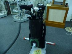 Golf Bag and Club with various putters, including golf balls, wedges and tees. Good assorted bag.