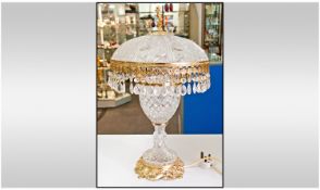 Classic Glass and Gilt Table Lamp with gilded base and mounted cherub finial. Probably Italian or
