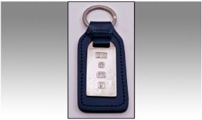 A Blue Leather and Silver Keyring with feature hallmarks for Sheffield. 1998 by The Posh Club and E