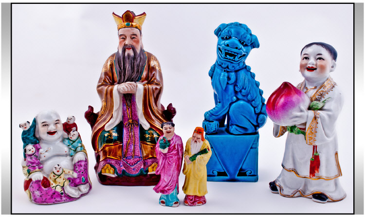 An Assorted Collection of Chinese Figures comprising a boy figure holding a peach, 8 inches in