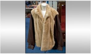 Mink Ladies Jacket with brown Leather Batwing Sleeves, fully lined. Label inside reads ``Furs by