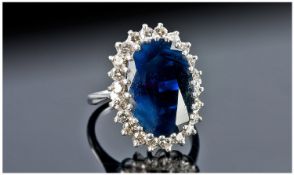 18ct White Gold Set Sapphire & Diamond Cluster Ring. The central single stone oval sapphire of dark