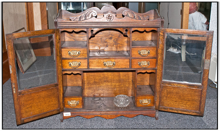 Large Edwardian Double Door Oak Smokers Cabinet, with glazed front and interior compartments.