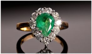 18ct Gold Pear Shaped Emerald and Diamond Ring. The single stone pear shaped emerald of good colour