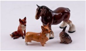 Four Beswick Animal Figures. Comprising a horse, two foxes and  rabbit. Sizes, horse 4.25 inches