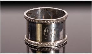A Heavy Solid Silver Napkin Ring. Plain finished with a rope edged pattern at the top and bottom.