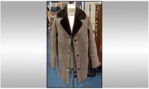 Taupe Sheepskin Suede Long Jacket with dark brown fur reverse forming the collar and inner, the