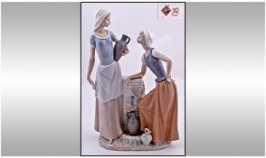 Nao by Lladro Large Figure - Two Water Carriers at the Water Hole, In Conversation. Mint Condition.