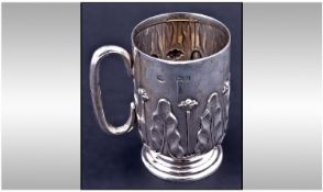 Art Nouveau Small Silver Tankard decorated with raised stylised tulips and leaves. Hallmark