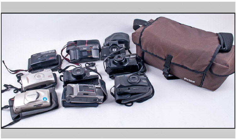 Collection Of Assorted Cameras In A Prinz Camera Bag. 9 in total. Cameras not tested on site.