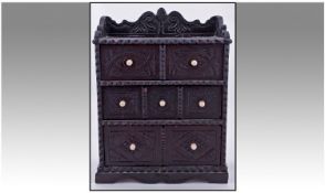 Miniature Carved Front Primitive Folk art  chest of draws. Consisting of 3 long draws, with a