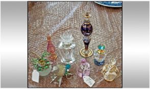 Eight Various Glass Scent Bottles of misc shapes and unusual stoppers. Together with an enamelled