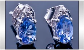 Tanzanite and Diamond Stud Earrings, each Comprising an Oval Cut. 5ct Tanzanite with a Round Cut