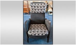 Contemporary Armchair of Modernist design and style, upholstered in black, with grey cushioned back