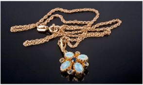 9ct Gold Set Opal Pendant - Fitted on a 9ct Gold Chain, The Four Opals Set In a Flower-Head Design.