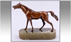 A 1960`s Realistically Modelled Bronze Horse Figure, raised on a oval shaped onyx base. Unsigned. 8