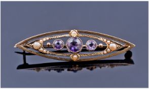 Victorian Art Nouveau 15 Carat Gold Set Amethyst and Seed Pearl Ladies Brooch. Marked 15 carat.