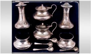 A Fine Silver Six Piece Cruet Set, Complete with Four Silver Spoons and Blue Liners. Hallmark
