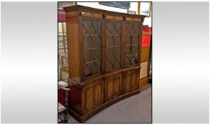 A Mahogany Glazed Door Display Cabinet with Sheraton style Lattice work to the doors. Concave shape