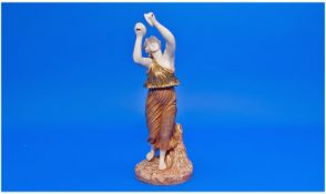 Royal Worcester Figure. A classical figure of a young woman playing cymbals dressed in a flowing