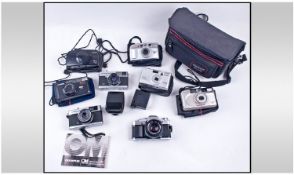 Collection Of Assorted Cameras. Includes Canon, Minolta, etc. Plus a medium camera bag. Not tested