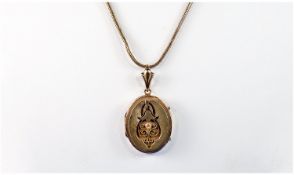 Victorian 9 Carat Gold Oval Shaped Hinged Locket fitted on a gold plated chain. Locket size 1 inch