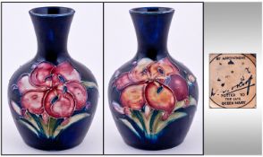 W. Moorcroft Miniature Vase Orchids - Design on Blue Ground. Label to Base Reads Potter to the Late