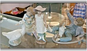 Collection Of Four Nao Figures, Boy With Dog, ``April Showers``, Girl With Doll And Swan.