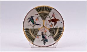 A Wedgewood Majolica Decorated Embossed Plate, with open fan design with panels of birds in cherry
