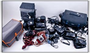 Collection Of Assorted Vintage Photography Cameras. Some include boxes, stored in four large cases.