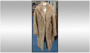 Ladies 3/4 Length Blonde Musquash Coat. Fully lined, slit pockets.