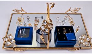 Swarovski Cut Crystal And Gold Display Tray, with a collection of 19 cut crystal miniatures and