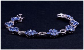 Tanzanite And Diamond Bracelet, eight clusters, each comprising six six pear cut and two trillion