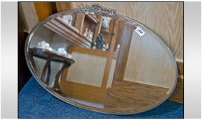 Art Deco Oval Chrome Mirror, bevelled glass. 17 inches in width.