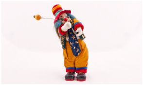 Vintage Hand Painted Mechanical and Musical Clown Figure, with original cloths. Height 11 inches.