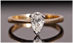 18ct Gold Set Single Stone Diamond Ring. The pear shaped diamond of good colour. Est. 0.62cts